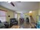 Comfortable living room featuring hardwood floors, ceiling fan, and natural light at 1786 S Seton Ave, Gilbert, AZ 85295