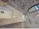Bathroom featuring dual sinks, granite countertops, decorative backsplash, and a glass-enclosed shower at 22508 W Antelope Trl, Buckeye, AZ 85326
