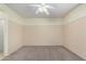 Spacious bedroom featuring neutral carpet, walls, and a ceiling fan at 22508 W Antelope Trl, Buckeye, AZ 85326