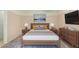 Comfortable bedroom with warm tones, side tables with lamps, and tasteful artwork for a peaceful retreat at 22508 W Antelope Trl, Buckeye, AZ 85326