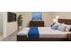 Relaxing bedroom featuring side tables with lamps, a comfortable bed, and stylish artwork for a tranquil night's rest at 22508 W Antelope Trl, Buckeye, AZ 85326