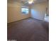 Bedroom with carpet, a window, and a ceiling fan at 22508 W Antelope Trl, Buckeye, AZ 85326