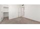 This bedroom includes carpet, an ensuite closet and white painted walls and doors at 22508 W Antelope Trl, Buckeye, AZ 85326