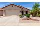 Charming single-story home features a well-manicured yard and attached two-car garage at 22508 W Antelope Trl, Buckeye, AZ 85326