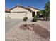 Charming single-story home with a two-car garage and low-maintenance desert landscaping in front yard at 22508 W Antelope Trl, Buckeye, AZ 85326