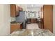 Kitchen showcasing wood cabinets, granite counters, and stainless steel appliances at 22508 W Antelope Trl, Buckeye, AZ 85326