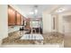 Bright kitchen featuring granite countertops, stainless steel appliances and breakfast bar at 22508 W Antelope Trl, Buckeye, AZ 85326