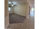 The living room offers plush carpeting and natural light, connecting to a tiled hallway and other living spaces at 22508 W Antelope Trl, Buckeye, AZ 85326