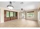 The open floorplan showcases a gorgeous entertainment center, neutral paint and seamless transition to the outdoors at 22508 W Antelope Trl, Buckeye, AZ 85326