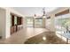 Spacious living room featuring neutral paint, built-in shelves and seamless flow to the outdoor space at 22508 W Antelope Trl, Buckeye, AZ 85326