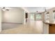 Bright living room showcases seamless transitions to an airy open floorplan with large format tile flooring at 22508 W Antelope Trl, Buckeye, AZ 85326