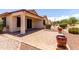 Paver patio for outdoor entertaining with adjacent green space at 22508 W Antelope Trl, Buckeye, AZ 85326