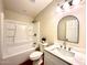 Bathroom features an updated vanity, new toilet, and a shower and tub combo at 2258 E Alpine Ave, Mesa, AZ 85204