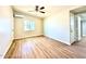 Cozy bedroom featuring new floors, a ceiling fan, and ample natural light at 2258 E Alpine Ave, Mesa, AZ 85204