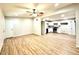 Spacious living room with new floors seamlessly connects to a modern, well-lit kitchen at 2258 E Alpine Ave, Mesa, AZ 85204