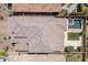 Aerial shot showcases the property's layout, featuring a pool, backyard, hardscape, and mature landscaping at 2321 W Brookhart Way, Phoenix, AZ 85085