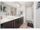 Bathroom vanity with dual vessel sinks, modern fixtures, and a large mirror at 2321 W Brookhart Way, Phoenix, AZ 85085