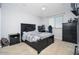 Bedroom features modern dark furniture, carpet, a ceiling fan, and LED accent lighting at 2321 W Brookhart Way, Phoenix, AZ 85085