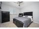 Neutral-toned bedroom featuring modern dark furniture, carpet, and a window at 2321 W Brookhart Way, Phoenix, AZ 85085