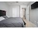 Bedroom featuring neutral walls, carpet, and a wall-mounted television at 2321 W Brookhart Way, Phoenix, AZ 85085