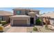 Aerial view of the exterior, displaying desert landscaping and a large tile roof at 2321 W Brookhart Way, Phoenix, AZ 85085