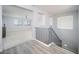 Bright hallway with stairs, wood-look floors, and an open view to the living area at 2321 W Brookhart Way, Phoenix, AZ 85085