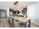 Modern kitchen with stainless steel appliances, center island and dark cabinets with granite countertops at 2321 W Brookhart Way, Phoenix, AZ 85085
