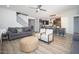 Open-concept living room showcasing a modern kitchen, comfortable seating, and stylish decor at 2321 W Brookhart Way, Phoenix, AZ 85085