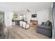 Bright living room with modern furnishings, open floor plan and large windows for natural light at 2321 W Brookhart Way, Phoenix, AZ 85085