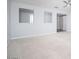 Inviting living area with a modern ceiling fan, plush carpet, and unique wall cutouts at 2321 W Brookhart Way, Phoenix, AZ 85085