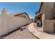 The backyard boasts decorative gravel, an AC unit, flagstone walkway, and privacy fence at 2723 N Winthrop --, Mesa, AZ 85213