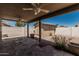 Covered patio with ceiling fans overlooks the fenced backyard at 2723 N Winthrop --, Mesa, AZ 85213