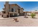 The backyard features a fountain, a patio, well-maintained gravel, and access to a second-story balcony at 2723 N Winthrop --, Mesa, AZ 85213