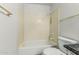 Neutral bathroom showcasing a shower-tub combo and updated fixtures at 2723 N Winthrop --, Mesa, AZ 85213