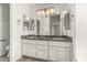 Bathroom features dual sink vanity with granite countertop and decorative lighting at 2723 N Winthrop --, Mesa, AZ 85213