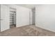 Bedroom with neutral carpet and an open closet with custom shelves at 2723 N Winthrop --, Mesa, AZ 85213