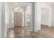 Bright foyer featuring tile flooring, arched entryway, and views into the living spaces at 2723 N Winthrop --, Mesa, AZ 85213