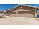 Charming two-story home boasts a three car garage, manicured lawn, and neutral color palette at 2723 N Winthrop --, Mesa, AZ 85213