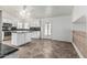 Well-lit kitchen featuring white cabinets, an island, and matching tile floors at 2723 N Winthrop --, Mesa, AZ 85213