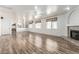 Open living room with wood floors, fireplace, and lots of natural light at 2723 N Winthrop --, Mesa, AZ 85213
