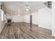 Spacious living room with wood floors, a fireplace, and access to other rooms at 2723 N Winthrop --, Mesa, AZ 85213
