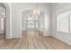 Bright living room with wood floors, multiple windows, and decorative lighting at 2723 N Winthrop --, Mesa, AZ 85213