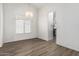 Bright living room showcasing a window with blinds and a view into the kitchen at 2723 N Winthrop --, Mesa, AZ 85213