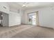 Carpeted main bedroom features a vaulted ceiling, ceiling fan, and balcony access at 2723 N Winthrop --, Mesa, AZ 85213