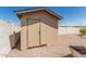 Backyard storage shed with door; backyard is covered in gravel at 2723 N Winthrop --, Mesa, AZ 85213