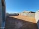 Expansive backyard enclosed by a concrete block wall ready for landscape design at 37153 W Prado St, Maricopa, AZ 85138