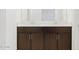 A close up view of the bathroom's double sink vanity with ample cabinet space at 37153 W Prado St, Maricopa, AZ 85138