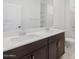 Modern bathroom featuring a double vanity, white countertops, and updated fixtures at 37153 W Prado St, Maricopa, AZ 85138