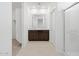 Bathroom features a double sink vanity, a tiled floor and a walk in shower at 37153 W Prado St, Maricopa, AZ 85138