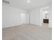This is a carpeted bedroom with neutral walls, with an ensuite bath and a walk-in closet at 37153 W Prado St, Maricopa, AZ 85138